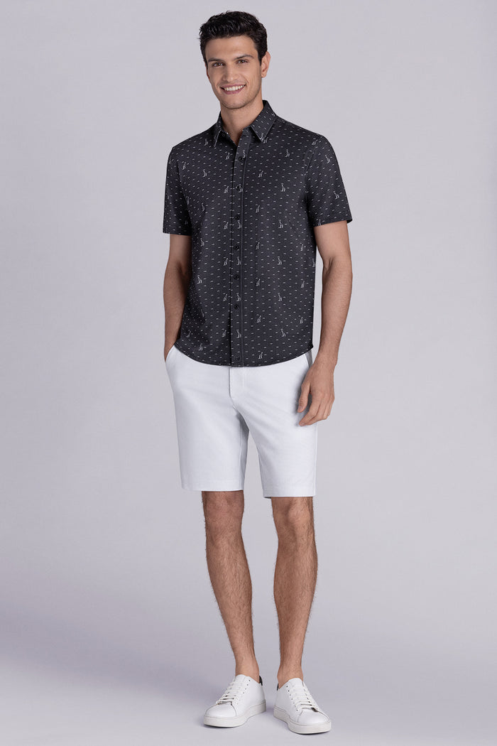 Model wear Intrepid Black short sleeve print shirt, styled with white shorts.