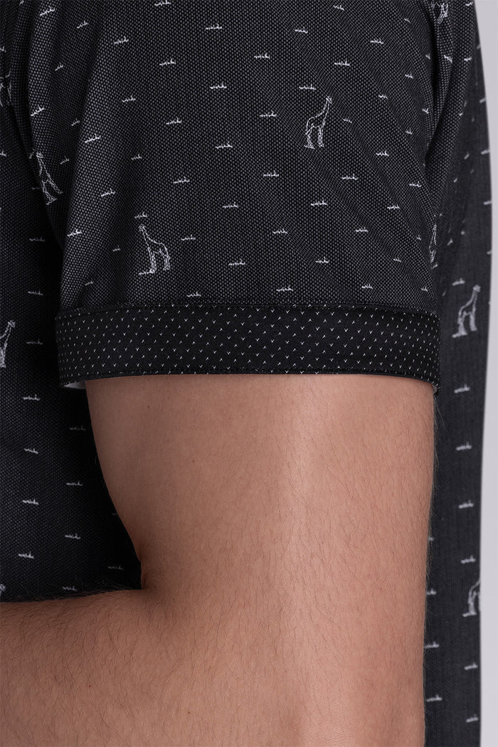 Model wear Intrepid Black short sleeve print shirt, styled with white shorts.