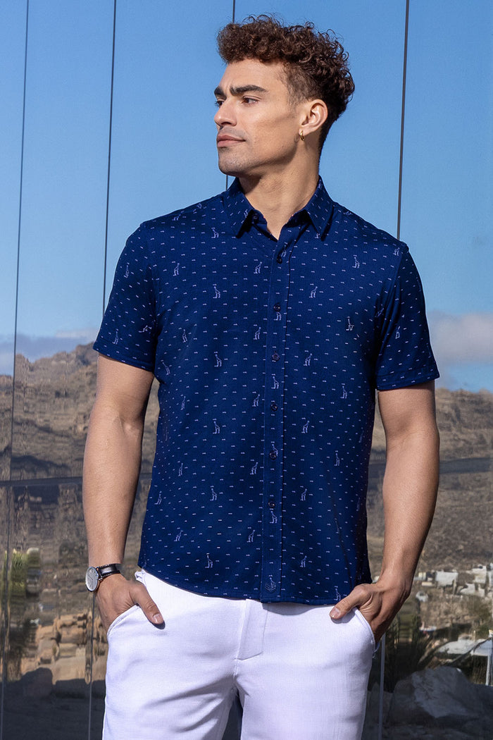 Model wear Intrepid Dark Navy short sleeve print shirt, styled with white shorts.