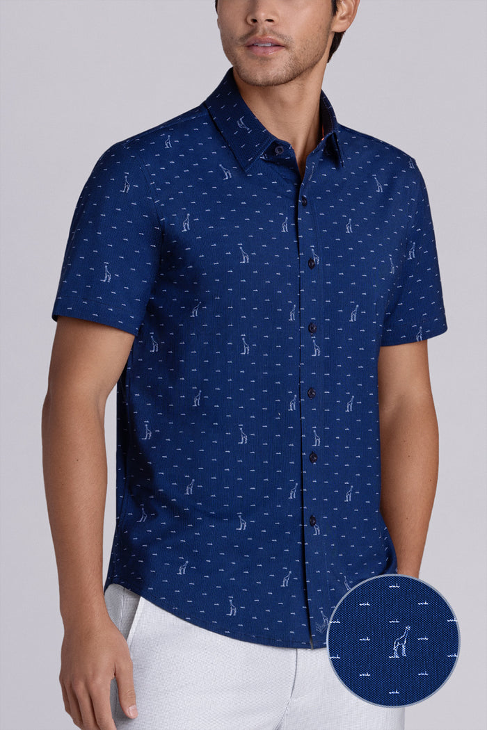 Model wear Intrepid Dark Navy short sleeve print shirt, styled with white shorts.