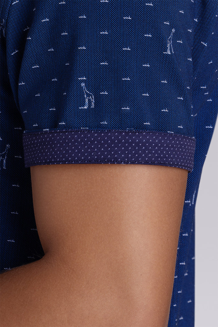 Model wear Intrepid Dark Navy short sleeve print shirt, styled with white shorts.