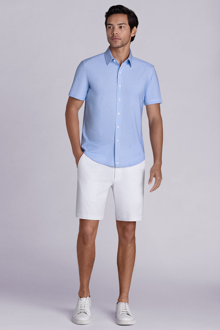 Model wear Intrepid Light Blue short sleeve print shirt, styled with white shorts.