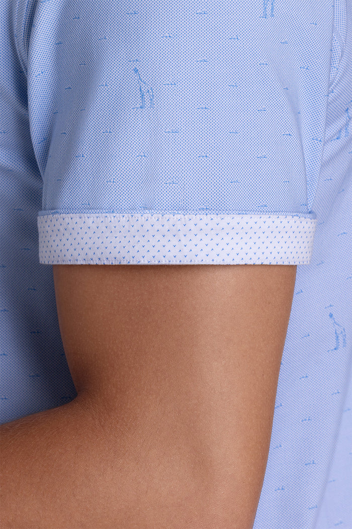 Model wear Intrepid Light Blue short sleeve print shirt, styled with white shorts.