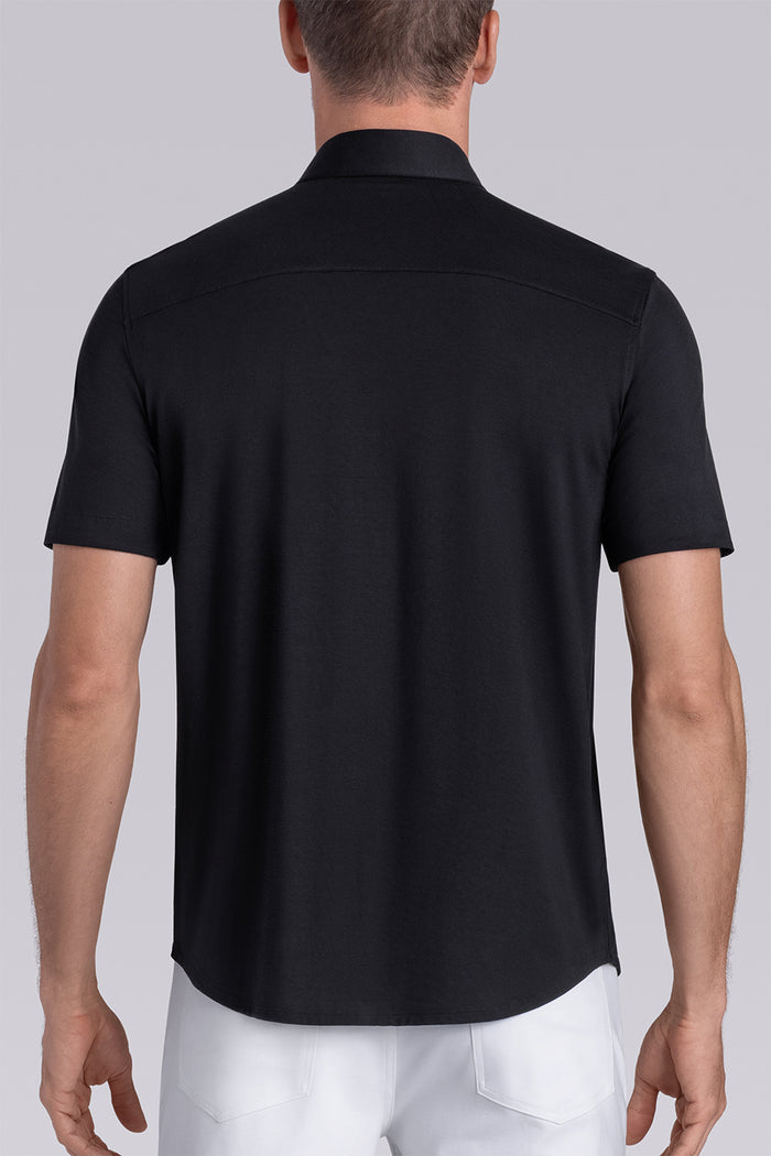 Model wear Intrigue Black Icy Bamboo® short sleeve collar shirt, styled with white pants.