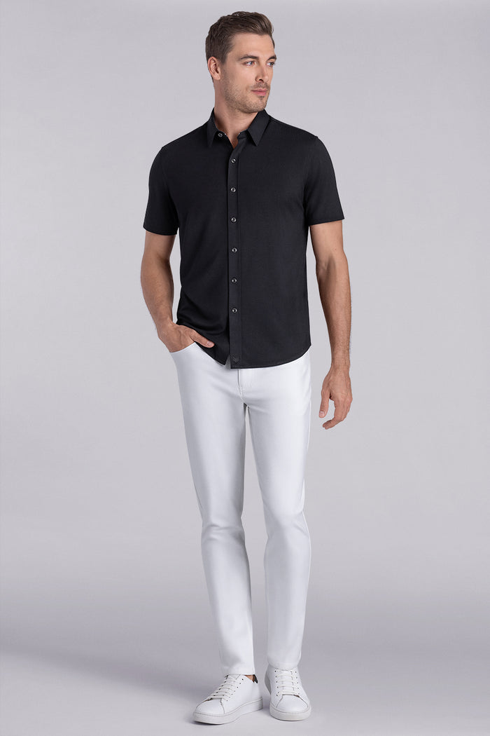 Model wear Intrigue Black Icy Bamboo® short sleeve collar shirt, styled with white pants.