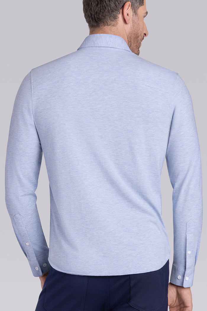 Model wearing the Invigorate Icy Blue Heather long sleeve dress shirt, styled with fitted black dress slacks.
