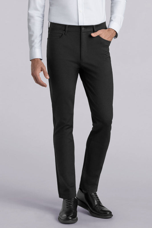 Model wearing Kinetic Black dress slacks pants, styled with comfortable white shirt