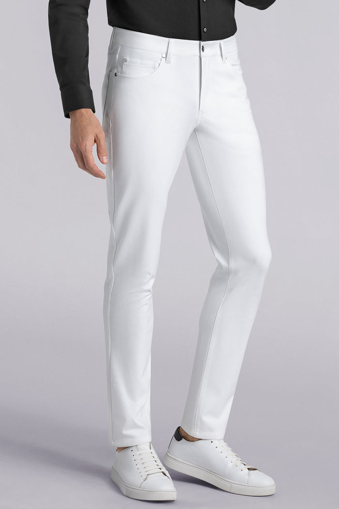 Model wearing Kinetic white dress slacks pants, styled with comfortable black shirt