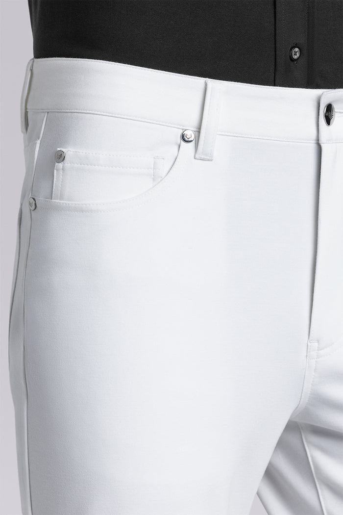 Model wearing Kinetic white dress slacks pants, styled with comfortable black shirt