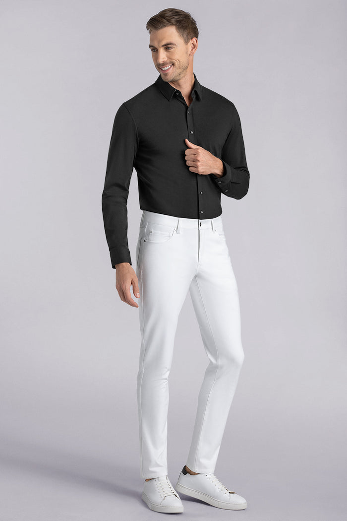 Model wearing Kinetic white dress slacks pants, styled with comfortable black shirt