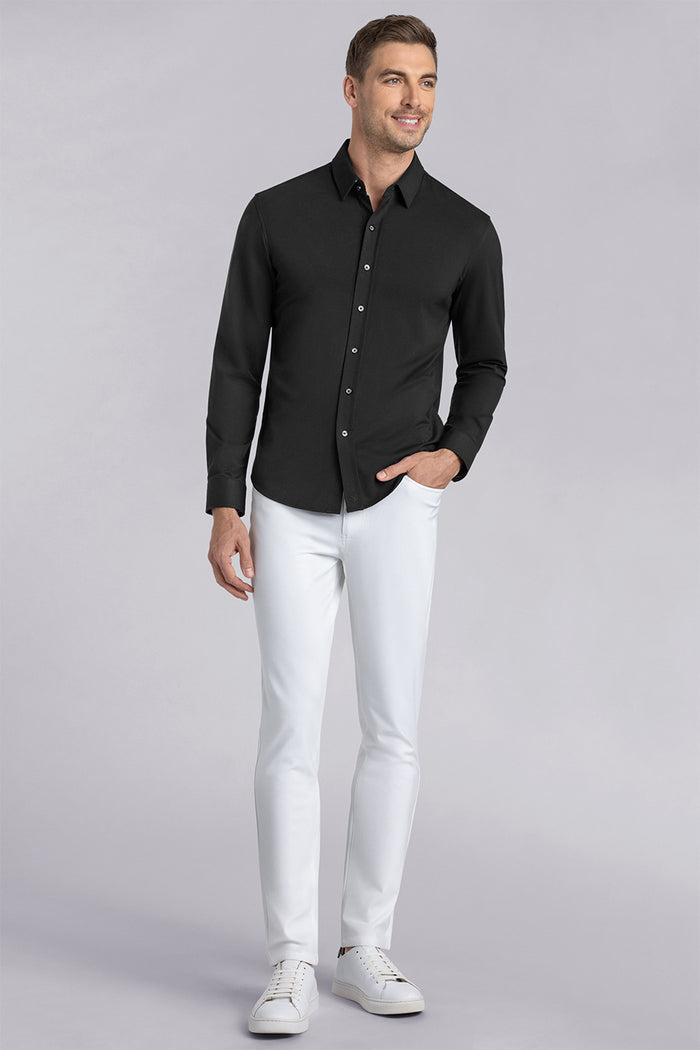 Model wearing Kinetic white dress slacks pants, styled with comfortable black shirt