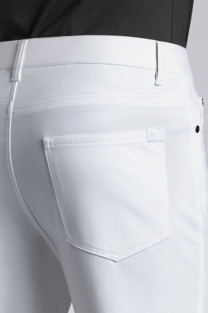 Model wearing Kinetic white dress slacks pants, styled with comfortable black shirt