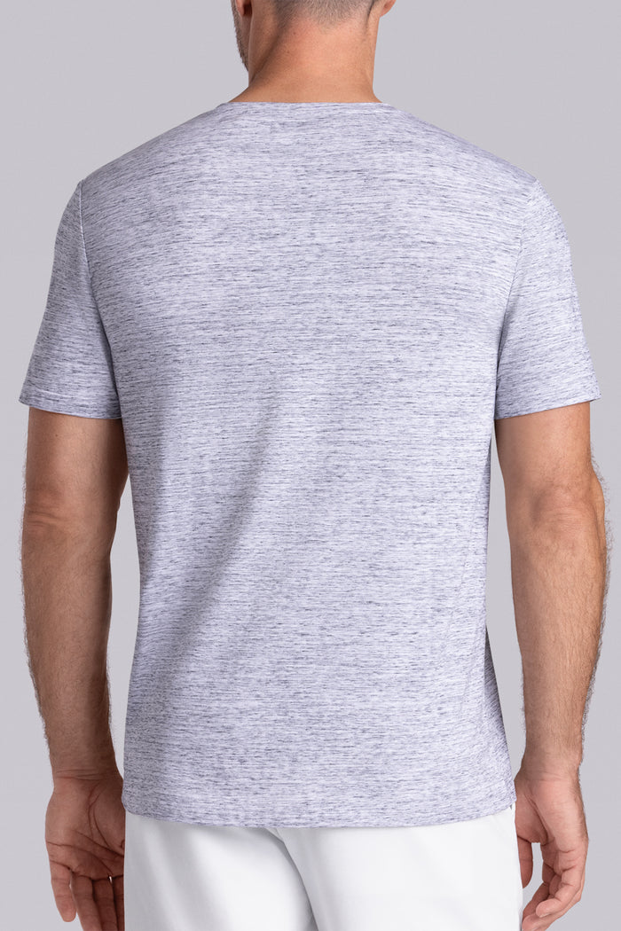 Model wear Lucid Bone White Heather Icy Cotton® short sleeve v-notch shirt, styled with white shorts