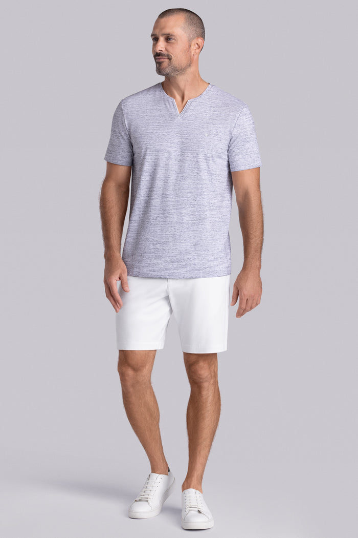 Model wear Lucid Bone White Heather Icy Cotton® short sleeve v-notch shirt, styled with white shorts