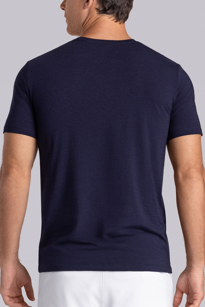 Model wear Lucid Navy Icy Cotton® short sleeve v-notch shirt, styled with white shorts