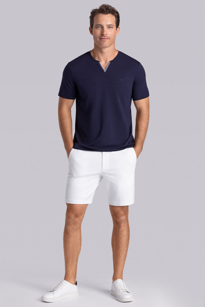 Model wear Lucid Navy Icy Cotton® short sleeve v-notch shirt, styled with white shorts
