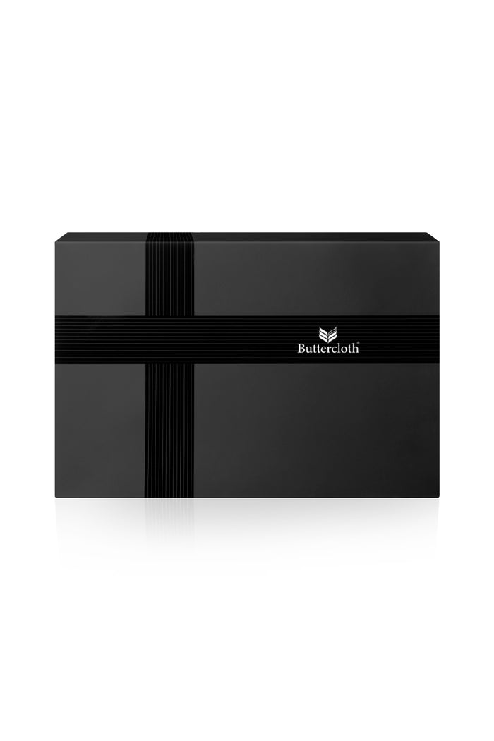 A black luxurious gift box with a black ribbon tied around it.