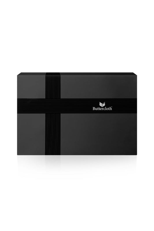 A black luxurious gift box with a black ribbon tied around it.