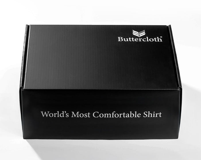 A black luxurious gift box with a black ribbon tied around it.