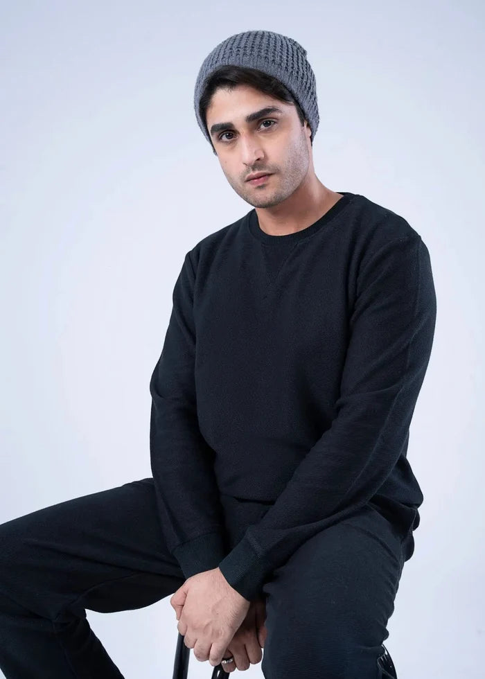 Men's black winter sweatshirt with long sleeves and crew neckline; close-up of fabric and seams.
