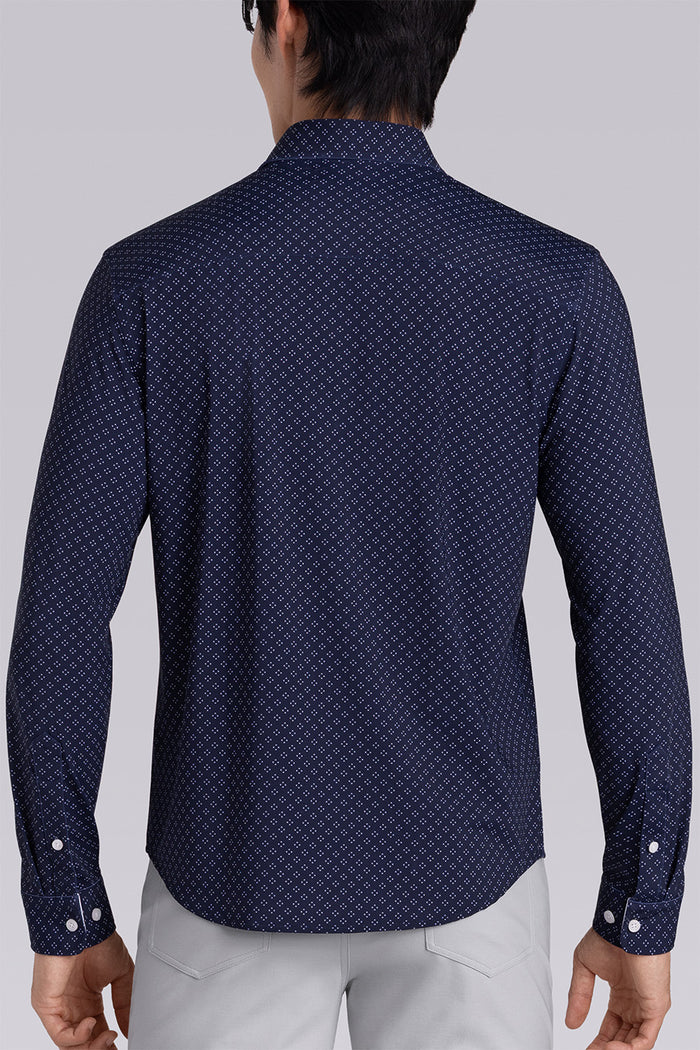 Model wearing Mesmerize Navy long sleeve dress shirt, styled with grey pants.