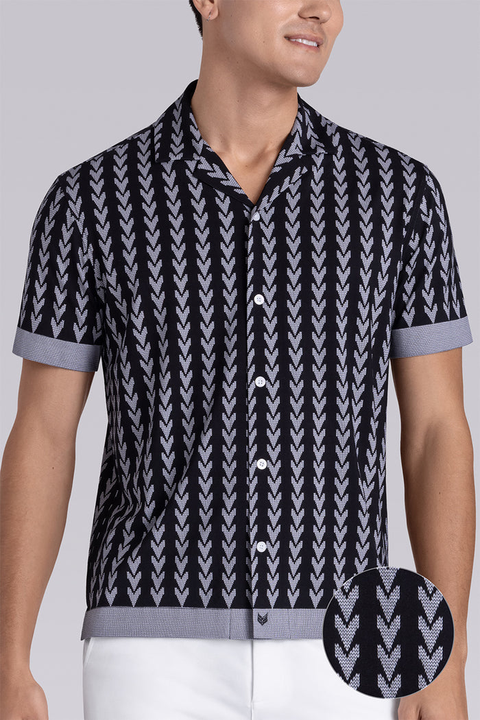 Model wear Mirage Black Icy Bamboo® short sleeve camp shirt, styled with white shorts