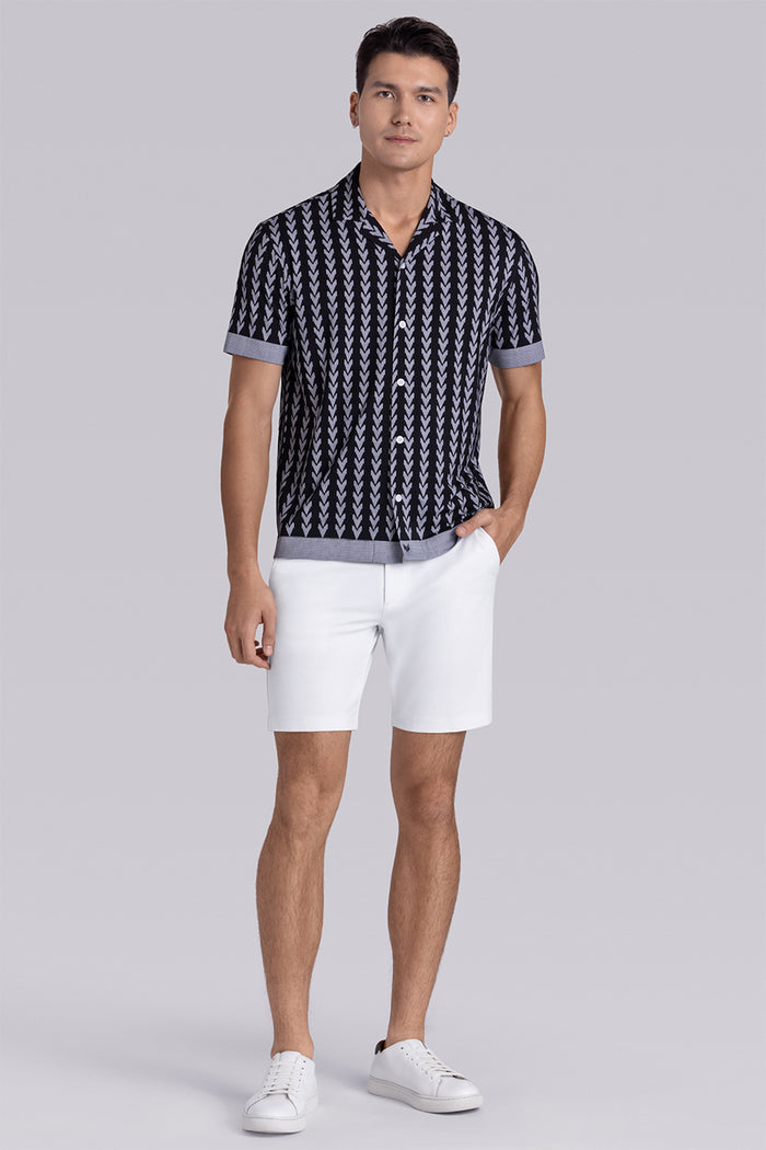 Model wear Mirage Black Icy Bamboo® short sleeve camp shirt, styled with white shorts