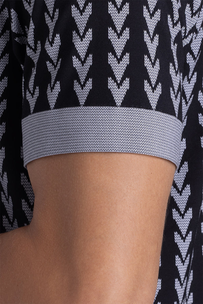 Model wear Mirage Black Icy Bamboo® short sleeve camp shirt, styled with white shorts