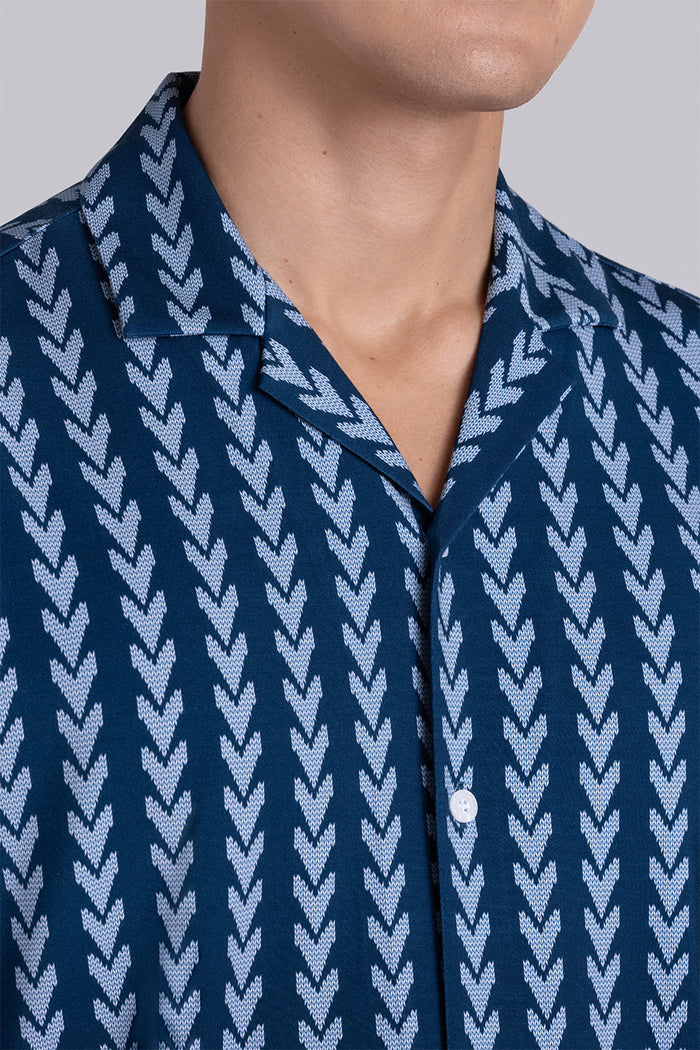 Model wear Mirage Vintage Blue Icy Bamboo® short sleeve camp shirt, styled with white shorts