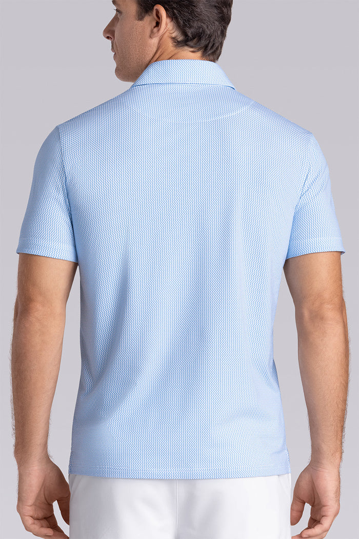 Model wearing Mosaic Light Blue Icy Cotton® short sleeve micro geo print polo, styled with white shorts.