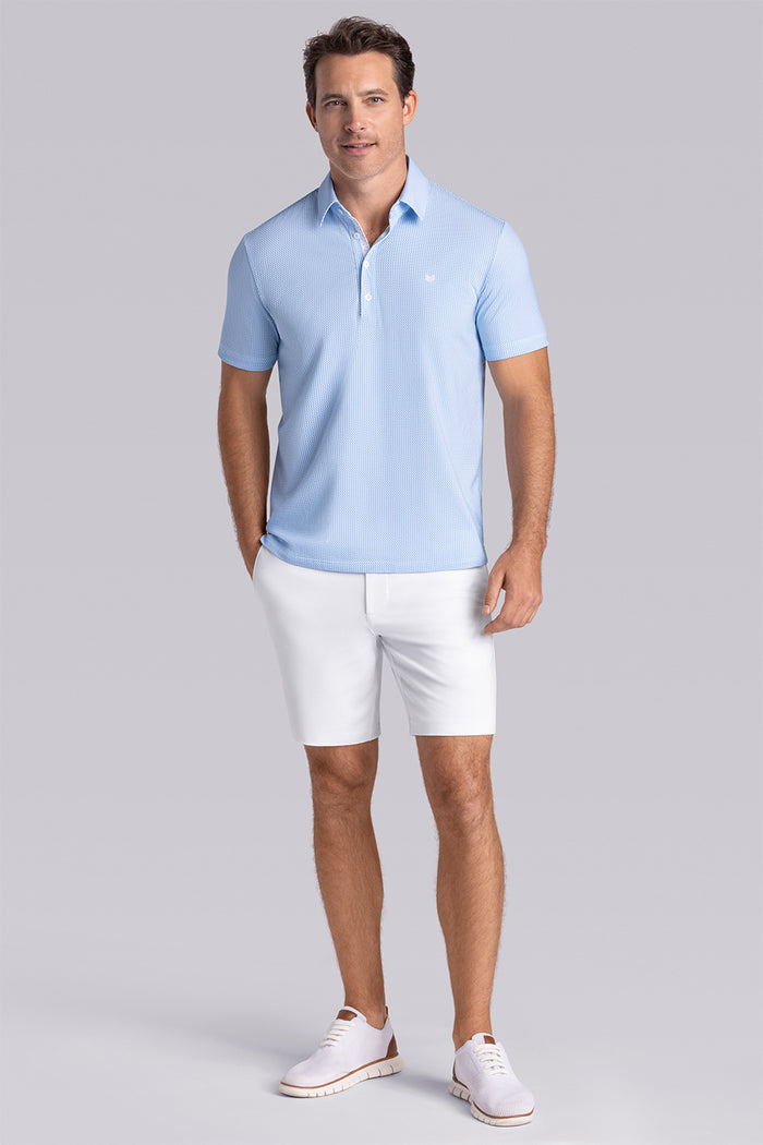 Model wearing Mosaic Light Blue Icy Cotton® short sleeve micro geo print polo, styled with white shorts.