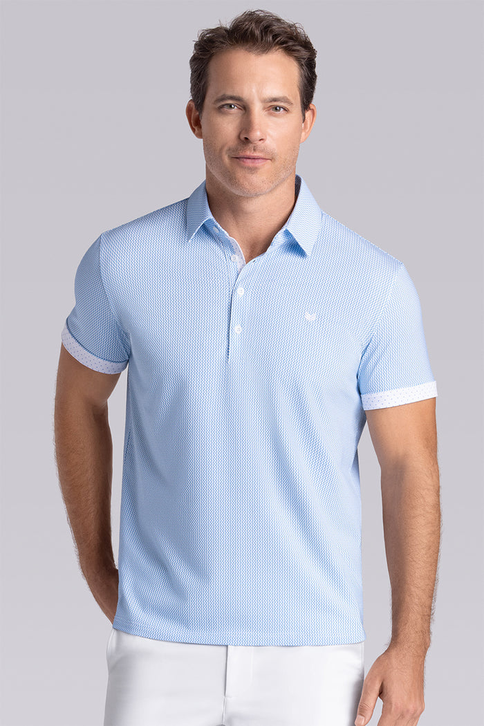 Model wearing Mosaic Light Blue Icy Cotton® short sleeve micro geo print polo, styled with white shorts.