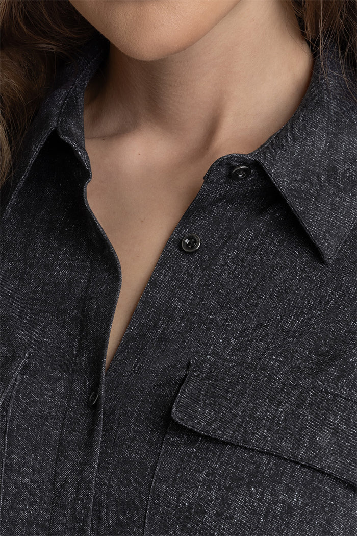 Model Motif Black Charcoal long sleeve button up blouse, styled with white pants