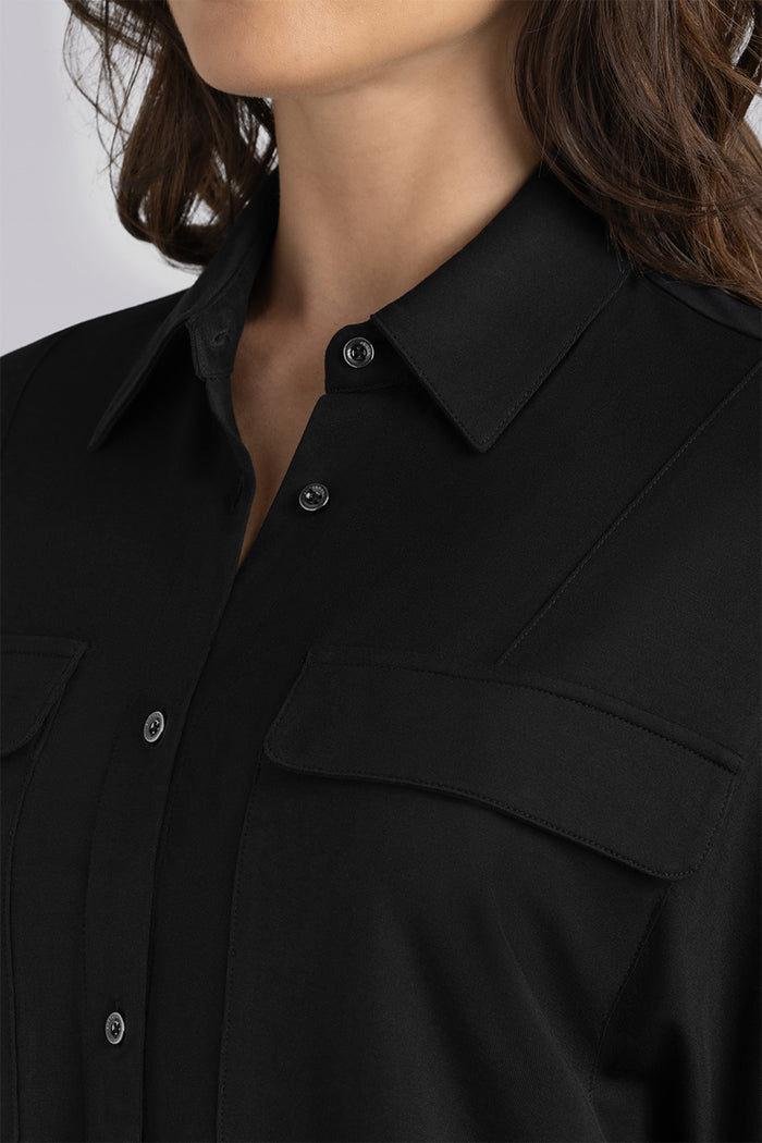 Model Motif Black long sleeve button up blouse, styled with white pants