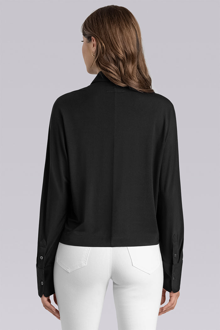 Model Motif Black long sleeve button up blouse, styled with white pants