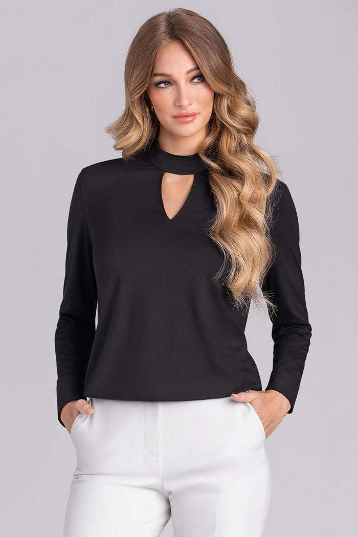 Model wearing Muse Black Icy Bamboo® keyhole mock neck long sleeve blouse, styled with white pants