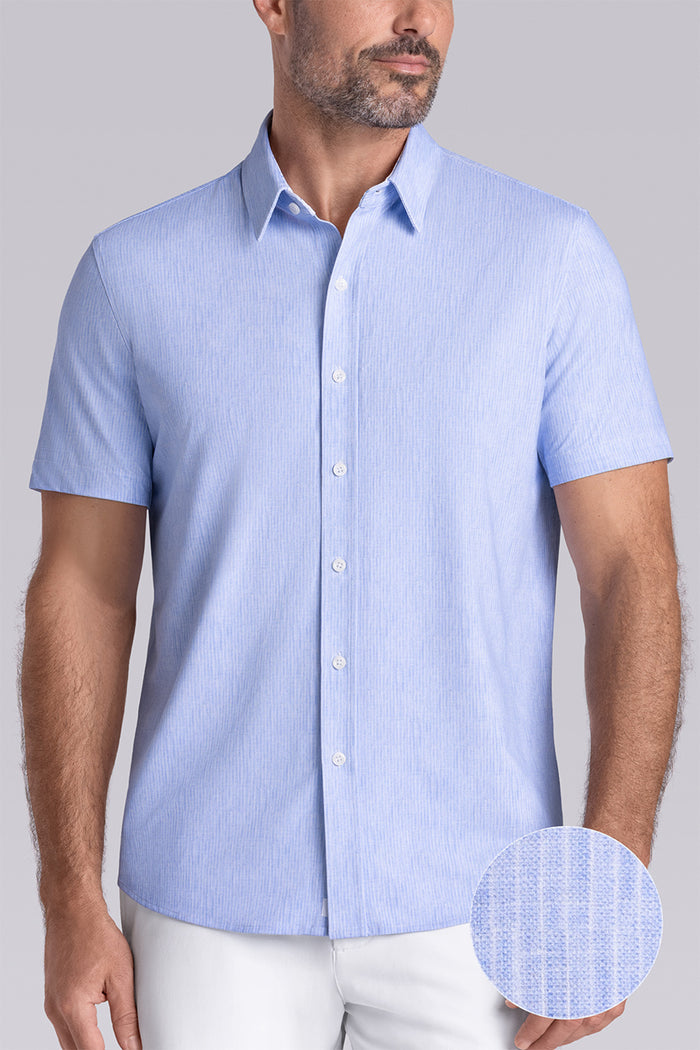 Model wearing Ocean Drive Icy Blue short sleeve button-up shirt, styled with white shorts