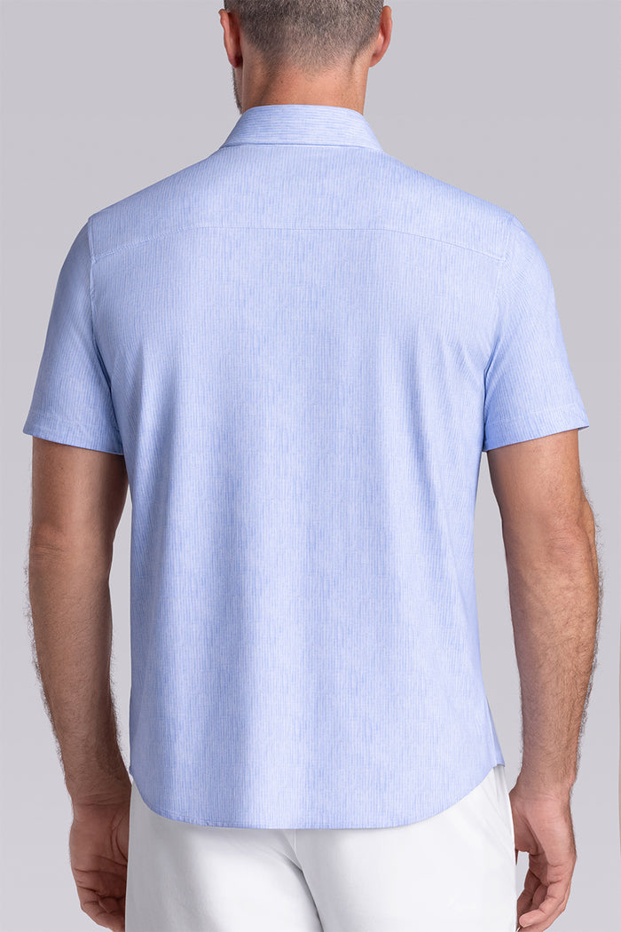 Model wearing Ocean Drive Icy Blue short sleeve button-up shirt, styled with white shorts