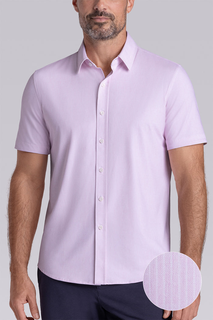 Model wearing Ocean Drive Light Pink short sleeve button-up shirt, styled with navy shorts