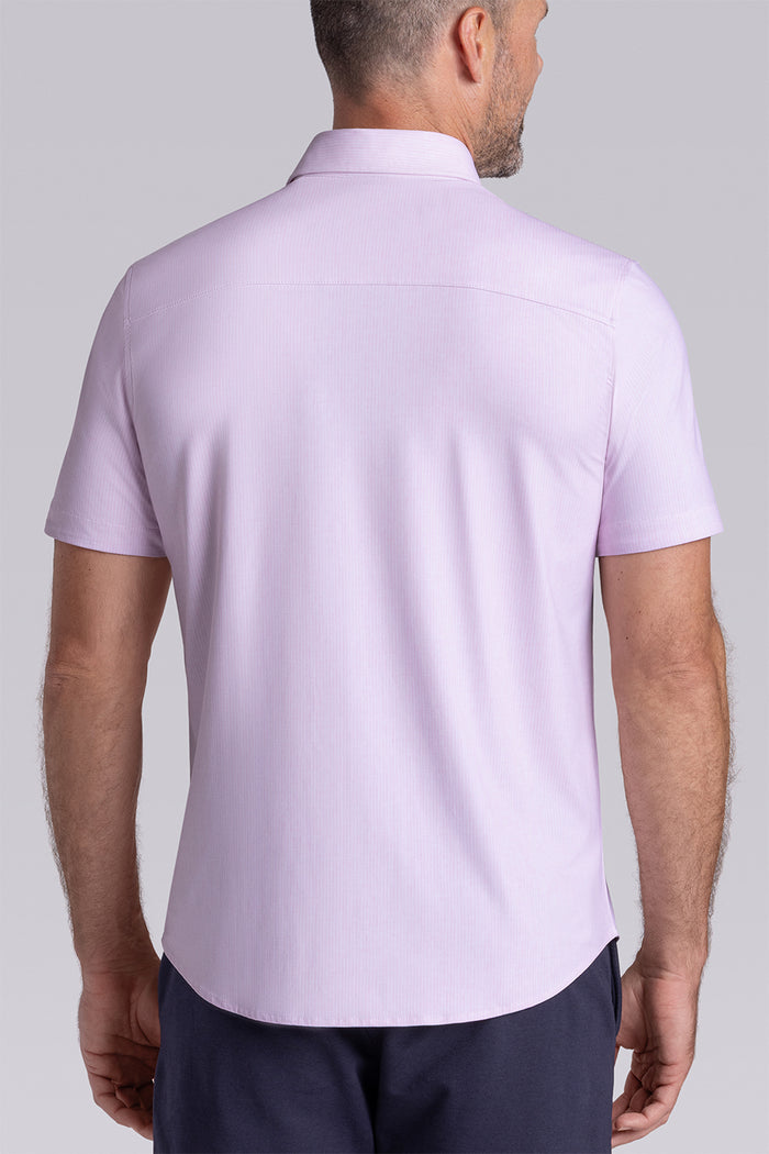 Model wearing Ocean Drive Light Pink short sleeve button-up shirt, styled with navy shorts