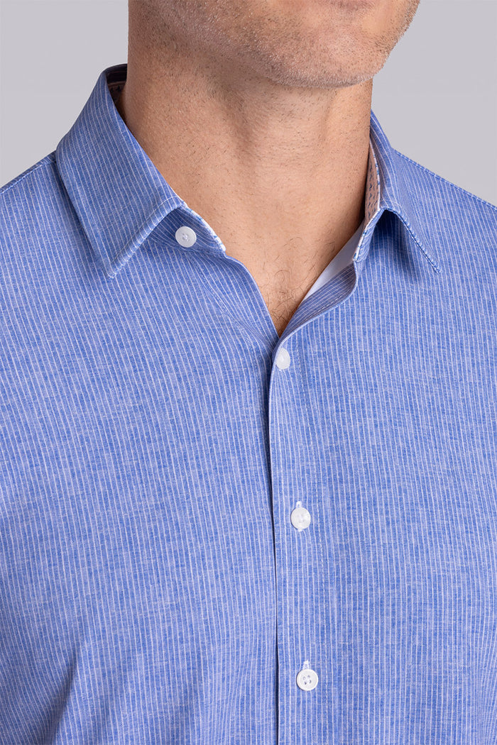 Model wearing Ocean Drive Palace Blue short sleeve button-up shirt, styled with white shorts