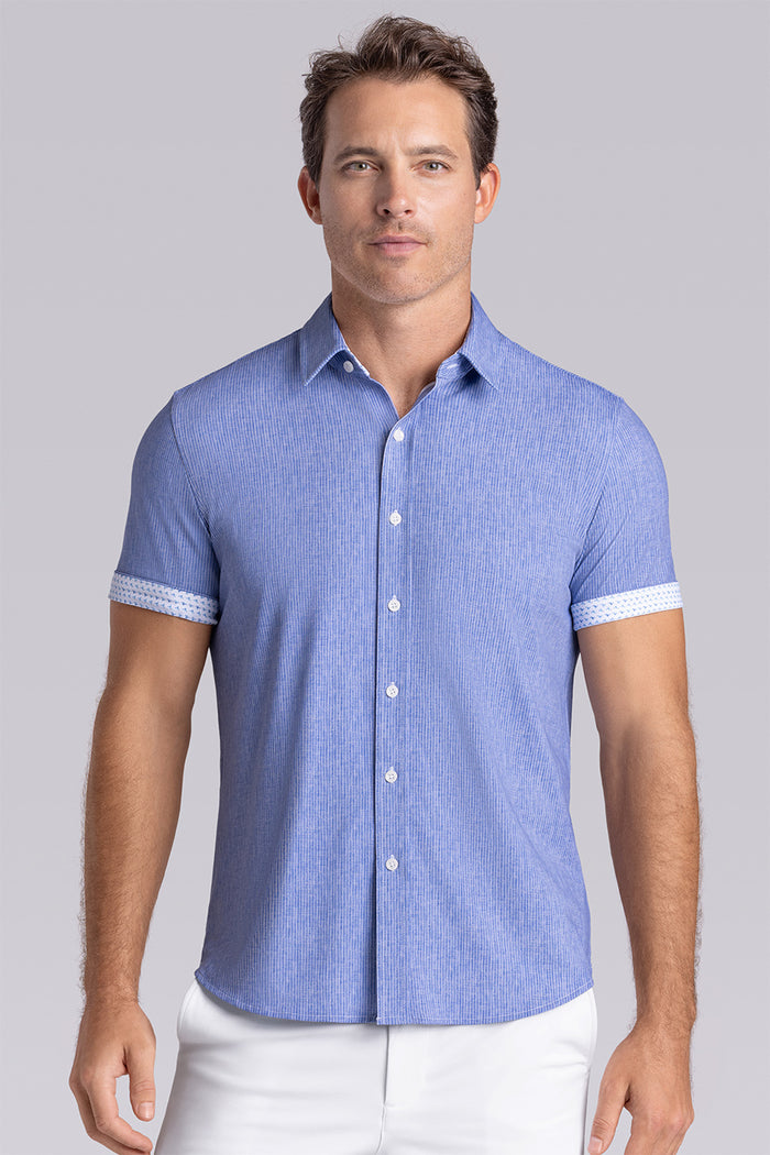 Model wearing Ocean Drive Palace Blue short sleeve button-up shirt, styled with white shorts