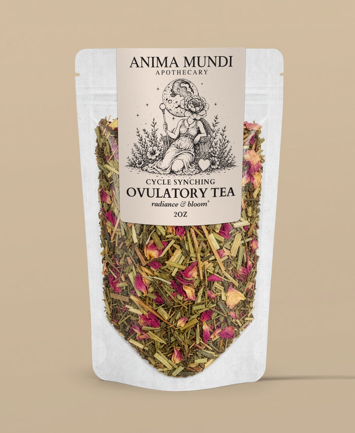 A stand-up pouch of Anima Mundi Apothecary Cycle Syncing Ovulatory Tea, featuring a cream-colored label with black text and an illustration of a woman holding a flower, with visible dried herbs and pink rose petals inside a clear lower section, set against a solid beige background.