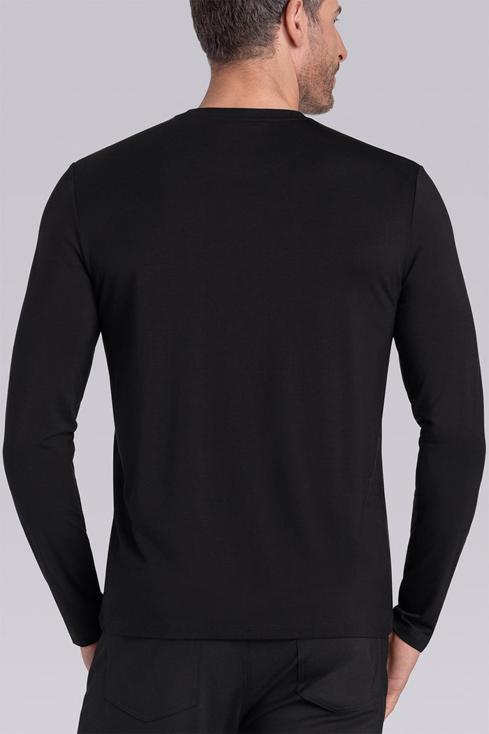 Model wearing Paramount Black long sleeve Icy Bamboo® crewneck, styled with black pants.