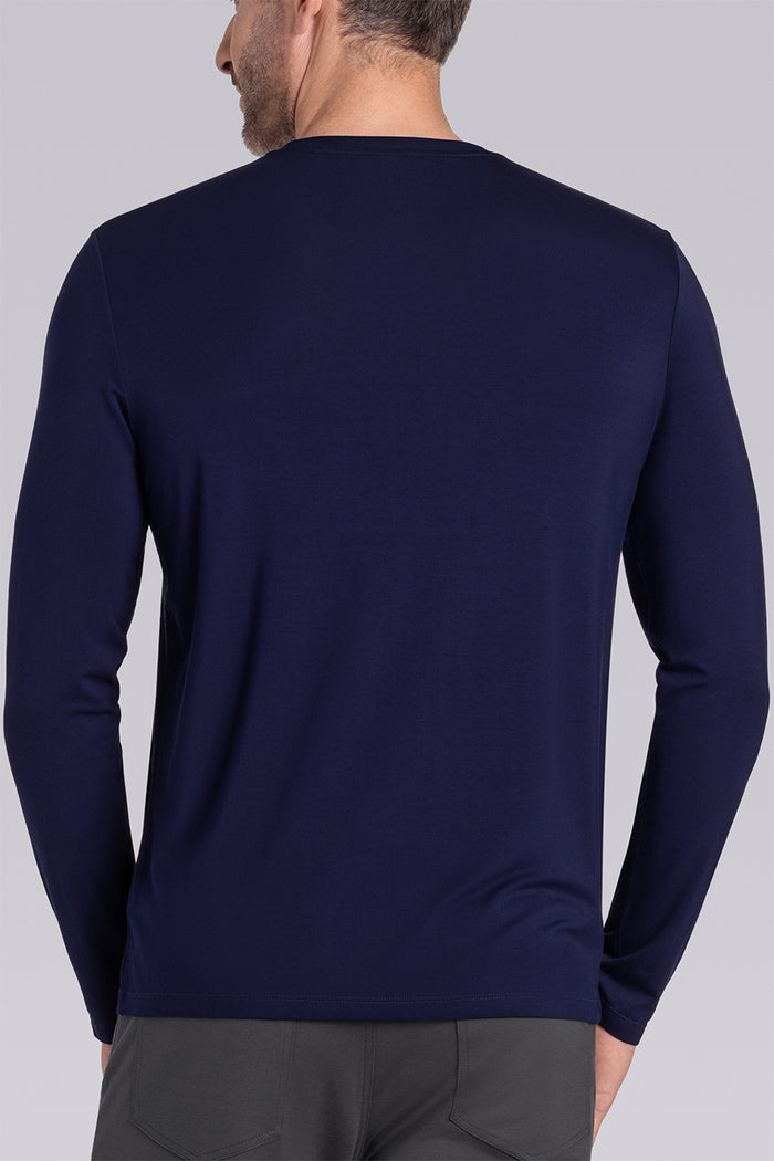 Model wearing Paramount Navy long sleeve Icy Bamboo® crewneck, styled with grey pants.