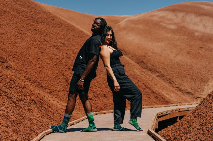 Lime Performance Wool Socks worn outdoors in an active lifestyle setting