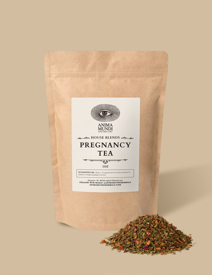 Pouch of Anima Mundi Pregnancy Tea with loose tea on a beige background