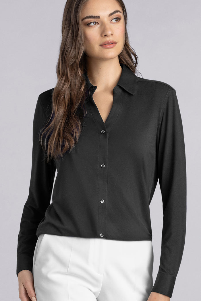 Model wearing Prestige Black long sleeve Icy Bamboo® v-neck shirt, styled with white pants