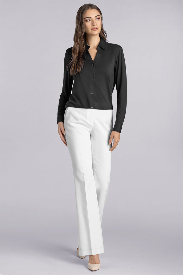 Model wearing Prestige Black long sleeve Icy Bamboo® v-neck shirt, styled with white pants
