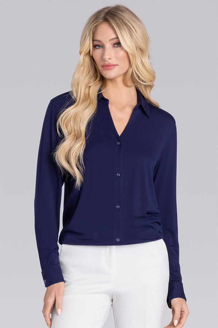 Model wearing Prestige Deep Sea Blue long sleeve Icy Bamboo® v-neck shirt, styled with white pants